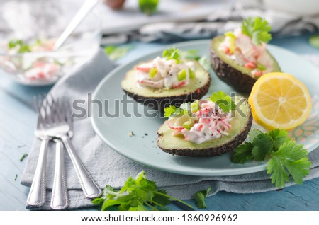 Bio organic avocado filled with homemade mayo, crab meat and herbs