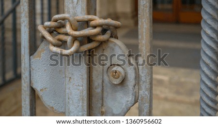 A chain locked the gate in church in Rome Italy the chains are a bit rusty and keeps the gate locked
