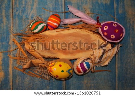 beautiful colorful, painted Easter eggs on blue wooden boards