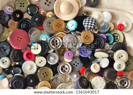 Many different bright vintage and new multicolored sewing buttons background