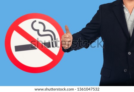 Business man show with no smoking sign ,health concept.
