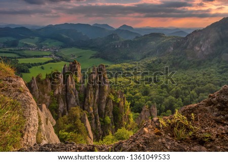 Bizarre stone needles, rocky steep and narrow hills suitable for adventurous climbing in Sulov on spring sunset with fresh green trees in forests