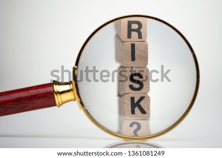 Letter Of Risk Word With Help Of Magnifying Glass