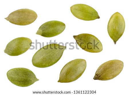 Pumpkin seeds isolated on white, top view Royalty-Free Stock Photo #1361122304