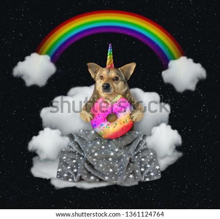 The dog unicorn with a big color donutis sitting on the cloud under the rainbow at night. Stars background.