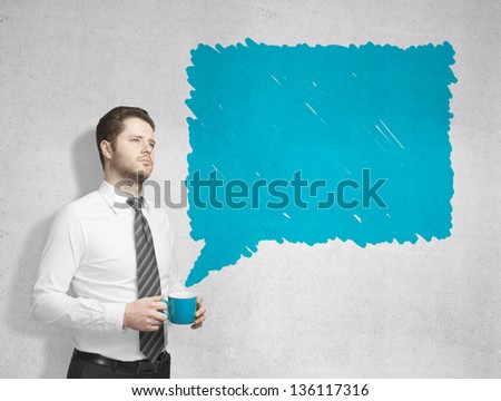 man with cup of coffee and drawing bubble talk