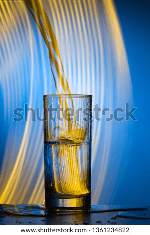 Water pours into the glass. Double exposure, creative photography