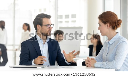 Male mentor insurance broker or bank manager consulting client making business offer at meeting, salesman insurer speaking sell services talking with customer explaining loan deal benefits in office Royalty-Free Stock Photo #1361250632
