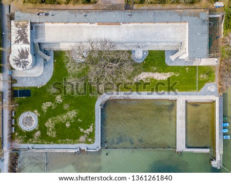 Aerial view of swimming baths on lakeside shore