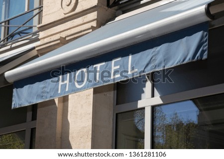 Hotel sign at the entrance of cozy accommodation