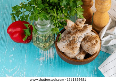 raw chicken legs for grilling and other ingredients