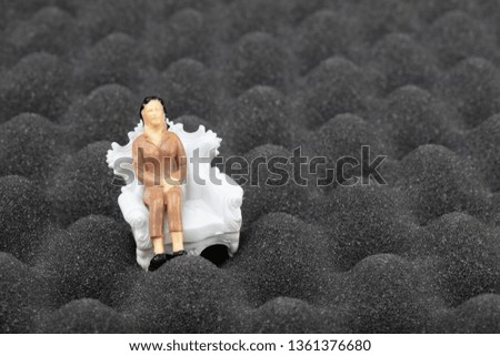 Acoustik sponge - Acoustik foam - fire retardant egg profile foam. Miniature people sound insulation concept.