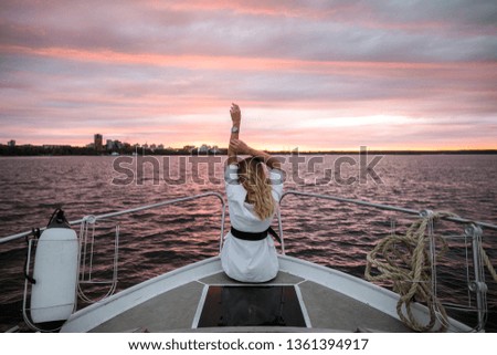 girl on the stern of the yacht
