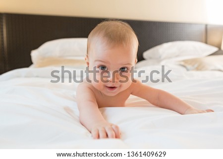 Beautiful baby on a bed