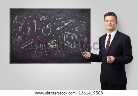 Handsome young teacher with laser pointer teaching 
