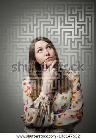 Young woman looking for the solution. Royalty-Free Stock Photo #136147652