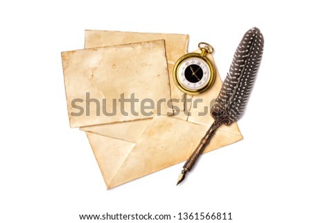 Vintage composition of yellowed cards with luxury quill pen and golden pocket watch isolated on white background