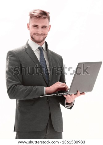 in full growth, a businessman with an open laptop