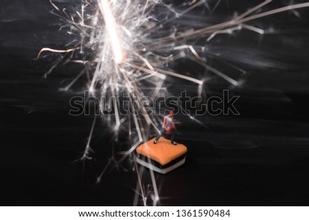 Miniature guitar solo man on black electric lightening background.Rock music and pyrotechnics concept.Little dude makes a big sound. Musician jamming is having a blast creating high energy loud music.
