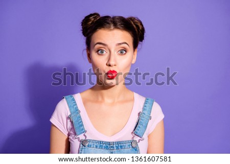 Close-up photo portrait of pretty attractive nice glad charming gorgeous she her student millennial sending kiss to you wearing cool outfit t-shirt isolated purple bright background