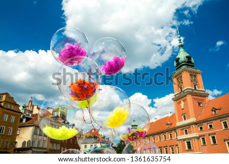 Architecture and balloons in the colorful Old Town of Warsaw, Poland's capital.