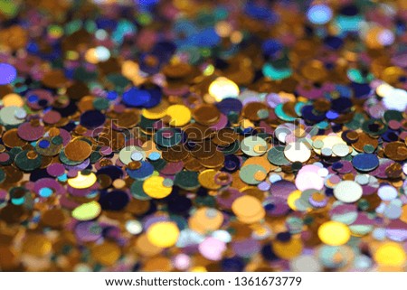 Colorful festive confetti. Bright colored background of confetti. Round blurred circles. Sparkling beauty shimmer, glitter. Colorful bokeh light.
