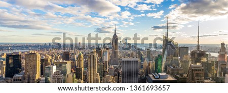 Amazing panorama view of  New York city skyline and skyscraper at sunlight in sunny day. Beautiful view in Midtown Manhatton, New York City, USA.