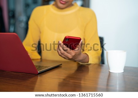 Young woman using a smart phone.