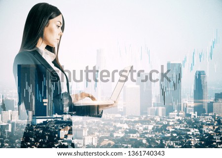 Side view of attractive young european businesswoman using laptop with forex chart on blurry city background. Communication and stats concept. Double exposure 