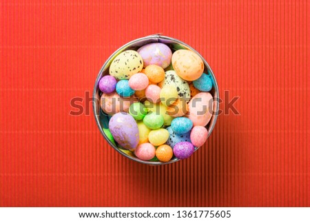 easter composition top view. eggs in the nest on pink coral paper background flat lay with space for text. Congratulatory easter background