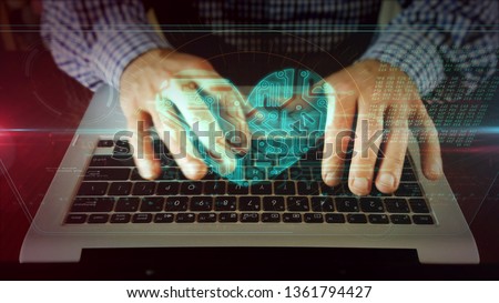 Man typing on laptop keyboard with heart on hologram screen. Cyber dating, love, romantic, rendez-vous, health and medical online care concept. Futuristic technology.