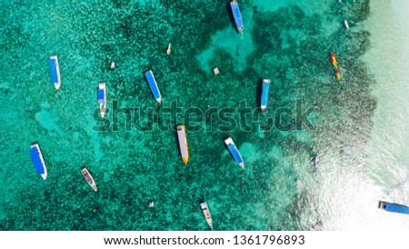 a collection of ships on the coast of Tanjung Tinggi Royalty-Free Stock Photo #1361796893