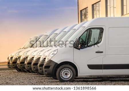 commercial delivery vans parked in row. Transporting service company. Royalty-Free Stock Photo #1361898566