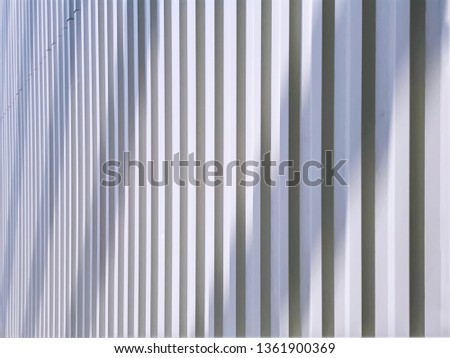 Full Frame Background of Perspective White Corrugated Wall with Light and Shadow