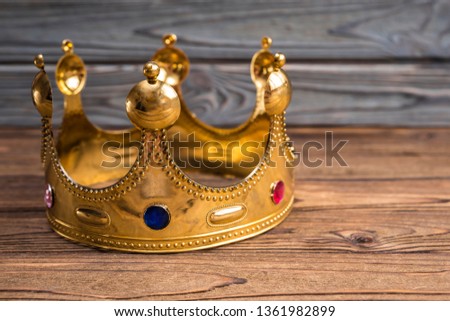 Royal crown of the Emperor on a wooden background. headdress of the reigning person.