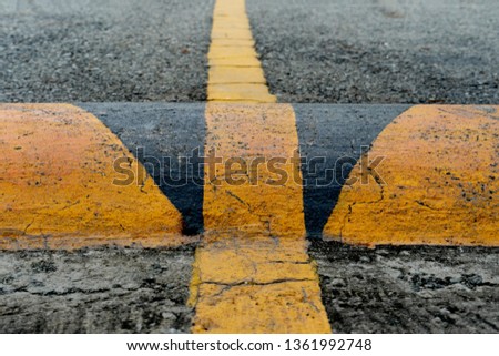 The speed reduction points painted yellow and black for clear visibility.