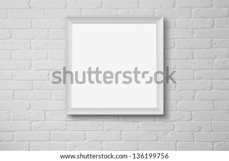 Blank picture frame at the white brick wall with copy space and clipping path