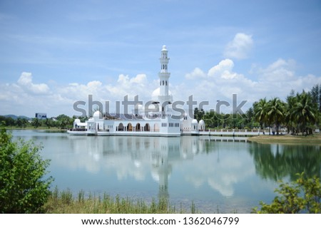 Beautiful scene of The Tengku Tengah Zaharah Mosque as known a Floating Mosque is the first real floating mosque in Malaysia. One of the most beautiful mosque on the water. The reflection was amazing.