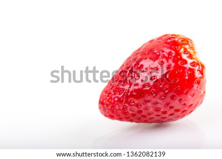 Close up detail of red fresh strawberries on white background.