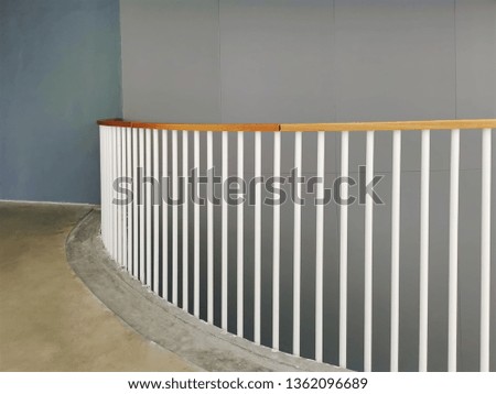 Curved Balcony with White Fencing Rods and Wood Rail