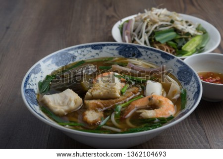 Vietnamese fermented fish soup (bun mam): Broth is made from fermented fish. It's then cooked with noodles, egg plants, shrimps, squids & grilled pork. The soup goes with water lilies, banana blossom