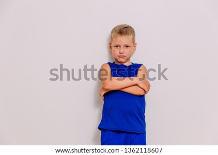 seven-year-old boy in the blue form on a white background