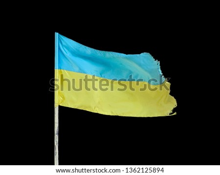 ukrainian flag, waving on blowing wind, isolated on black