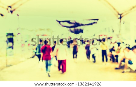 Vintage tone Abstract Blurred image of People walking at Day market on street  with bokeh for background usage .