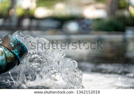 Water flow treatment system from the water pump pipe.Motion of water gushing out of the pipe from Koi Pond Carp fish farm for oxygen.Water was drain by tube pvc.Industrial wastewater treatment. Royalty-Free Stock Photo #1362152018
