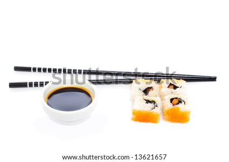 Sushi with soy sauce and chopsticks on white background. Shallow depth of field