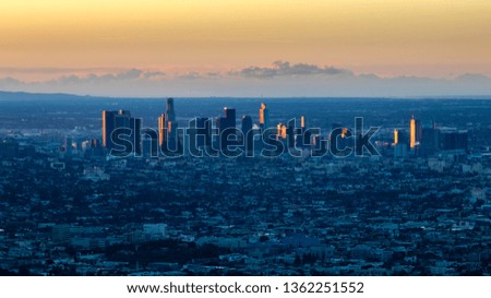 The morning winter sun rises over downtown Los Angeles in February 2019.