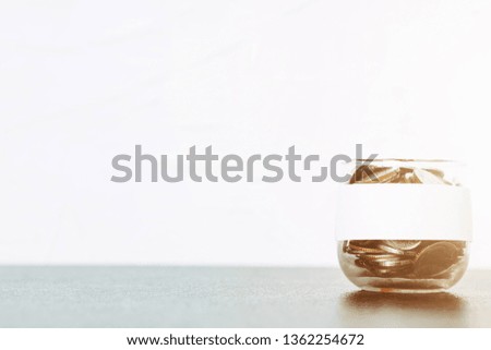 Background of coins stacks in pig jar with empty label banner profession business saving plan for family invest long-term in retirement real estate, wealth management investment 
