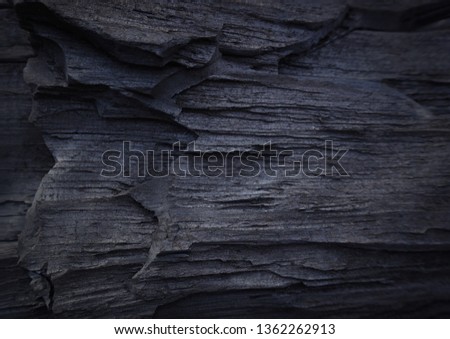 Black stone background. Top view. Free copy space.                               