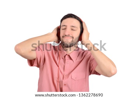 Portraif of young funny man with headphones. Isolated on white background.